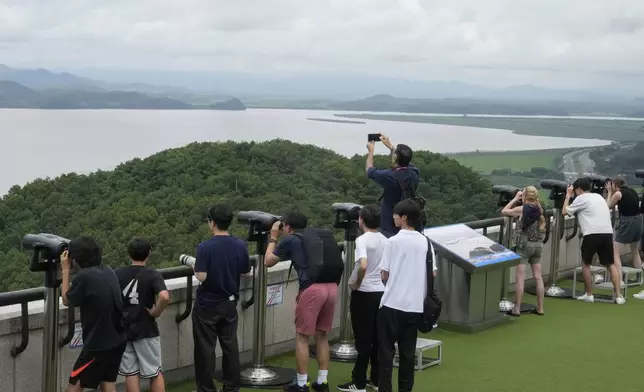 Visitors watch the North Korea side from the Unification Observation Post in Paju, South Korea, near the border with North Korea, Wednesday, July 24, 2024. (AP Photo/Ahn Young-joon)