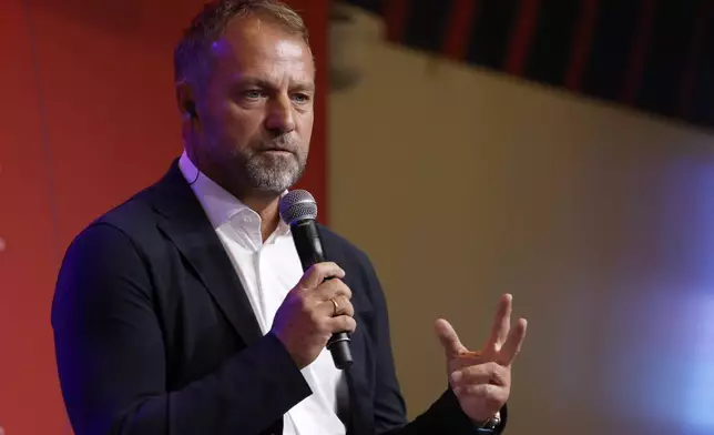 Barcelona's new coach Hansi Flick speaks during an official presentation in Barcelona, Spain, Thursday, July 25, 2024. FC Barcelona and Hansi Flick have reached an agreement for the German to become men's first team football coach until 30 June 2026. (AP Photo/Joan Monfort)