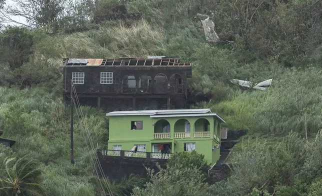 Houses damaged by Hurricane Beryl in Kingstown, Srt. Vincent and the Grenadines, Monday, July 1, 2024. (AP Photo/Lucanus Ollivierre)