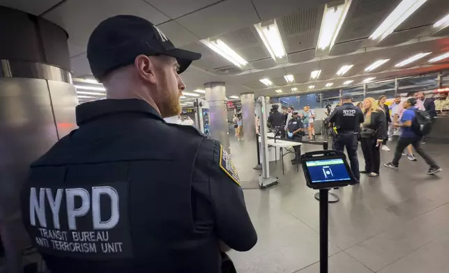 Gun detection machines are tested at the Fulton Street transit station before a news conference with New York Mayor Eric Adams, Friday, July 26, 2024, in New York. New York City is turning to AI-powered scanners in a new bid to keep guns out of its subway system. (AP Photo/John Minchillo)