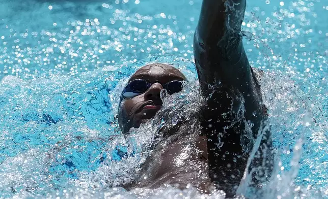 Ziyad Saleem swims while being interviewed in Berkeley, Calif., Tuesday, May 28, 2024. Saleem, a University of California swimmer, is headed to the Paris Olympics to swim for Sudan, his parents' home country and one almost all of his relatives have now fled because of war and a massive humanitarian crisis. (AP Photo/Jeff Chiu)