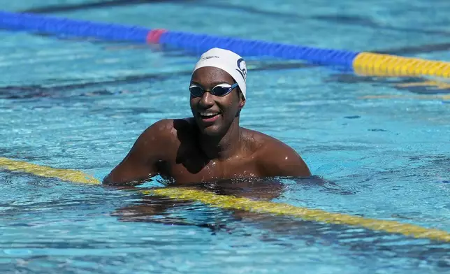 Ziyad Saleem smiles while being interviewed in Berkeley, Calif., Tuesday, May 28, 2024. Saleem, a University of California swimmer, is headed to the Paris Olympics to swim for Sudan, his parents' home country and one almost all of his relatives have now fled because of war and a massive humanitarian crisis. (AP Photo/Jeff Chiu)