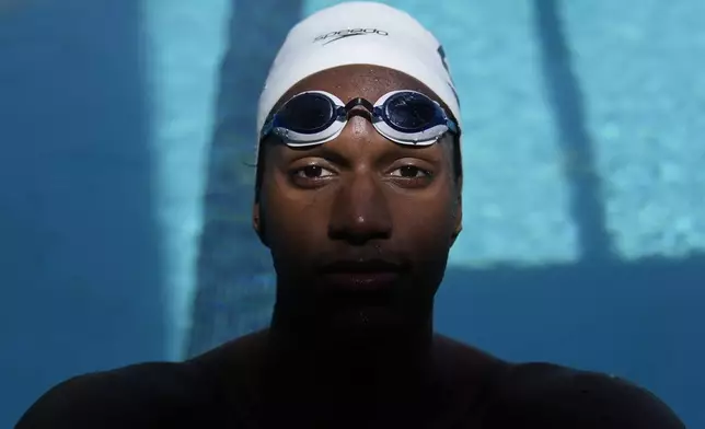 Ziyad Saleem poses in Berkeley, Calif., Tuesday, May 28, 2024. Saleem, a University of California swimmer, is headed to the Paris Olympics to swim for Sudan, his parents' home country and one almost all of his relatives have now fled because of war and a massive humanitarian crisis. (AP Photo/Jeff Chiu)