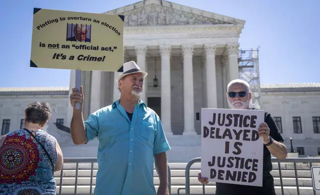 Gary Roush of College Park, Md., and left, and Bill Christeson protest Monday, July 1, 2024, outside the Supreme Court in Washington. (AP Photo/Jacquelyn Martin)