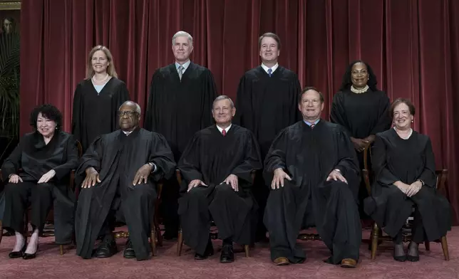 FILE - Members of the Supreme Court sit for a group portrait in Washington, Oct. 7, 2022. Bottom row, from left, Justice Sonia Sotomayor, Justice Clarence Thomas, Chief Justice John Roberts, Justice Samuel Alito and Justice Elena Kagan. Top row, from left, Justice Amy Coney Barrett, Justice Neil Gorsuch, Justice Brett Kavanaugh, and Justice Ketanji Brown Jackson. The Supreme Court justices will take the bench Monday, July 1, 2024, to release their last few opinions of the term, including their most closely watched case: whether former President Donald Trump has immunity from criminal prosecution. (AP Photo/J. Scott Applewhite)