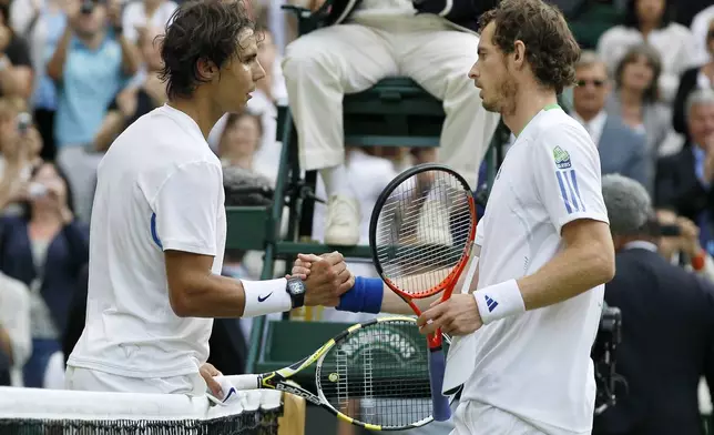FILE - Spain's Rafael Nadal, left, shakes hands after defeating Britain's Andy Murray in the men's semifinal match at the All England Lawn Tennis Championships at Wimbledon, Friday, July 1, 2011. Murray will play only doubles at his last appearance at the All England Club following his withdrawal from singles after back surgery. (AP Photo/Kirsty Wigglesworth, File)