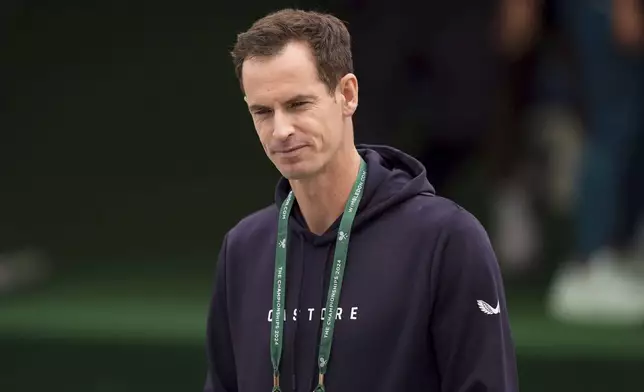 Britain's Andy Murray looks on in the warm up area on day two of the Wimbledon tennis championships, in London, Tuesday, July 2, 2024. Murray will play only doubles at his last appearance at the All England Club following his withdrawal from singles after back surgery. (Jordan Pettitt/PA via AP)