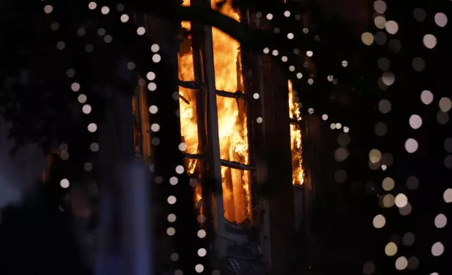 Fire burns inside the First Baptist Dallas church on Friday, July 19, 2024, in downtown Dallas. (Chitose Suzuki/The Dallas Morning News via AP)