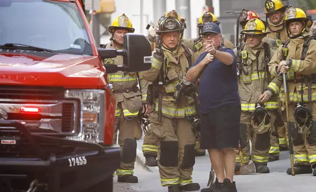 Firefighters respond to a fire at First Baptist Dallas church on Friday, July 19, 2024, in downtown Dallas. (Chitose Suzuki/The Dallas Morning News via AP)