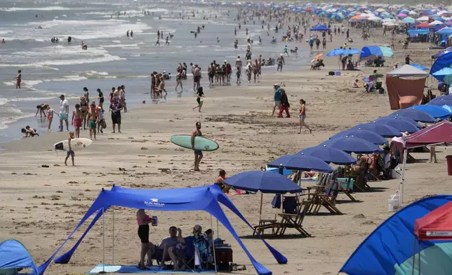 Visitors crowd the beaches in Port Aransas, Texas, ahead of Hurricane Beryl's arrival, Saturday, July 6, 2024. (AP Photo/Eric Gay)