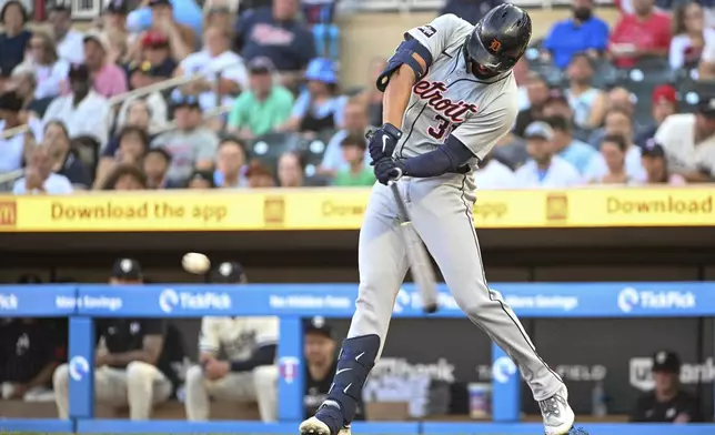 Detroit Tigers' Riley Greene hits a triple against Minnesota Twins starting pitcher David Festa during the first inning of a baseball game, Wednesday, July 3, 2024, in Minneapolis. (AP Photo/Craig Lassig)