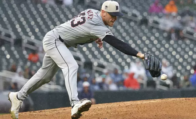 Detroit Tigers relief pitcher Joey Wentz attempts to field the ball hit for a single by Minnesota Twins' Ryan Jeffers during the sixth inning of a baseball game, Thursday, July 4, 2024, in Minneapolis. (AP Photo/Matt Krohn)