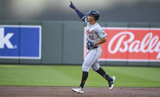 Detroit Tigers' Wenceel Perez celebrates as he rounds the bases after hitting a home run against Minnesota Twins starting pitcher David Festa during the third inning of a baseball game, Wednesday, July 3, 2024, in Minneapolis. (AP Photo/Craig Lassig)