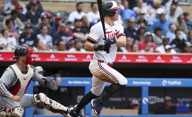 Minnesota Twins' Max Kepler hits a two RBI single against the Detroit Tigers during the second inning of a baseball game, Thursday, July 4, 2024, in Minneapolis. (AP Photo/Matt Krohn)