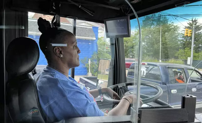 Laticia Wright operates a bus for the Central Ohio Transit Authority on Wednesday, July 3, 2024, in Columbus, Ohio. Reports of crime against transit workers and passengers have been rising since the pandemic erupted in 2020, when millions of Americans suddenly avoided subways and buses. Their exodus left transit workers more isolated and vulnerable to attacks. (AP Photo/Patrick Orsagos)