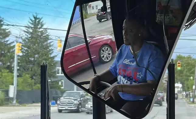 Laticia Wright operates a bus for the Central Ohio Transit Authority on Wednesday, July 3, 2024, in Columbus, Ohio. Reports of crime against transit workers and passengers have been rising since the pandemic erupted in 2020, when millions of Americans suddenly avoided subways and buses. Their exodus left transit workers more isolated and vulnerable to attacks.(AP Photo/Patrick Orsagos)