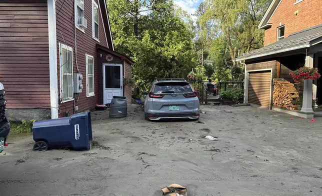 An SUV sits in flood debris in Plainfield, Vermont, Thursday, July 11, 2024. (AP Photo/Lisa Rathke)