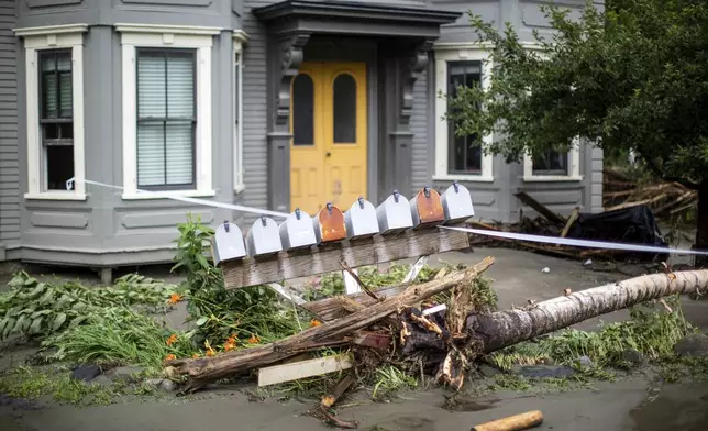 Debris and damaged mailboxes sit outside a home following flooding caused by the remnants of Hurricane Beryl, Thursday, July 11, 2024, in Plainfield, Vt. (AP Photo/Dmitry Belyakov)