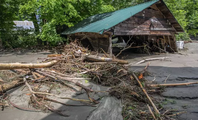 Debris is strewn about following flooding caused by the remnants of Hurricane Beryl, Thursday, July 11, 2024, in Plainfield, Vt. (AP Photo/Dmitry Belyakov)