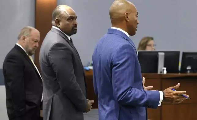 Chief Deputy District Attorneys Marc DiGiacomo, left, and Binu Palal listen as attorney Carl Arnold, right, representing Duane "Keffe D" Davis, who is accused of orchestrating the 1996 slaying of hip-hop icon Tupac Shakur, addresses the court during a hearing to reconsider Davis' bond at the Regional Justice Center, on Tuesday, July. 23, 2024, in Las Vegas. (Bizuayehu Tesfaye/Las Vegas Review-Journal via AP)