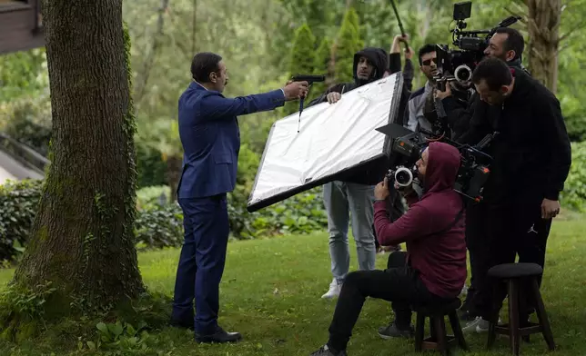 A production team is filming scenes of a Turkish drama in Istanbul Turkey, Tuesday, April 30, 2024. (AP Photo/Khalil Hamra)