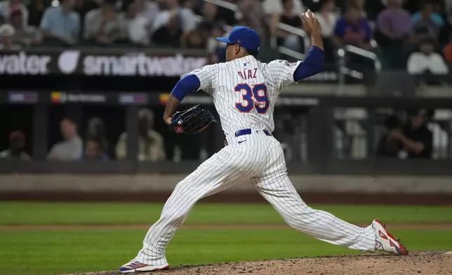 New York Mets' Edwin Díaz pitches during the eighth inning of a baseball game against the Minnesota Twins, Tuesday, July 30, 2024, in New York. (AP Photo/Pamela Smith)