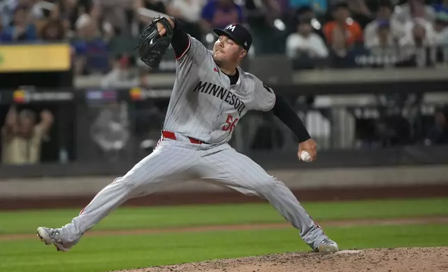 Minnesota Twins' Caleb Thielbar pitches during the eighth inning of a baseball game against the New York Mets, Tuesday, July 30, 2024, in New York. (AP Photo/Pamela Smith)