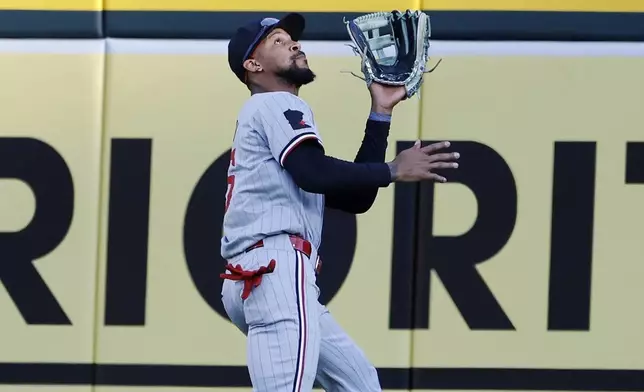 Minnesota Twin center fielder Byron Buxton catches a sacrifice fly ball hit by Detroit Tigers' Mark Canha during the sixth inning of a baseball game Saturday, July 27, 2024, in Detroit. (AP Photo/Duane Burleson)