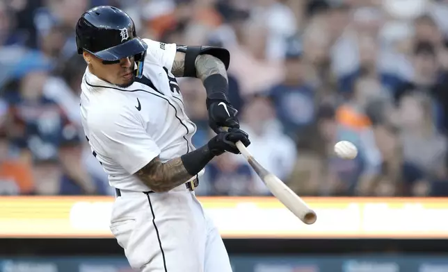 Detroit Tigers' Javier Baez hits a two-run home run against the Minnesota Twins during the seventh inning of a baseball game Saturday, July 27, 2024, in Detroit. (AP Photo/Duane Burleson)