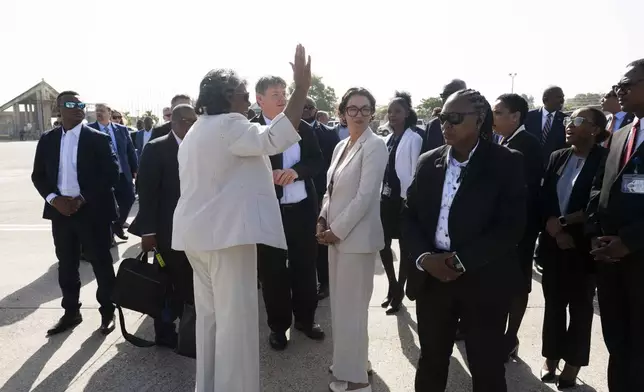 U.S. Ambassador to the United Nations Linda Thomas-Greenfield, waves upon arrival in Port-au-Prince, Haiti, Monday, July 22, 2024. Thomas-Greenfield is scheduled to hold talks with the country's transitional presidential council and new Prime Minister Garry Conille during the day-long trip. (Roberto Schmidt/Pool via AP)