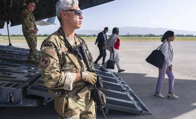 U.S. Ambassador to the United Nations Linda Thomas-Greenfield, second right, steps off a U.S. Air Force plane upon arrival in Port-au-Prince, Haiti, Monday, July 22, 2024. Thomas-Greenfield is scheduled to hold talks with the country's transitional presidential council and new Prime Minister Garry Conille during the day-long trip. (Roberto Schmidt/Pool via AP)