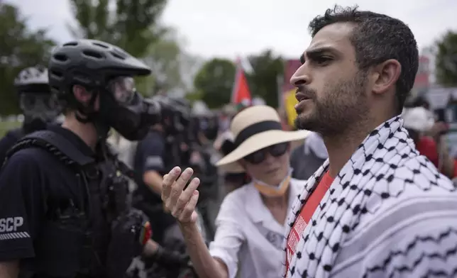 United States Capitol Police stand near protestors, Wednesday, July 24, 2024, in Washington, during of a scheduled visit by Israeli Prime Minister Benjamin Netanyahu at the U.S. Capitol. (AP Photo/Mike Stewart)