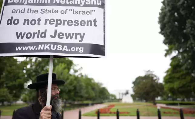 A Hasidic jew protesting against Israeli Prime Minister Benjamin Netanyahu, stands near the White House, ahead of a scheduled White House visit by Netanyahu, Thursday, July 25, 2024, in Washington. (AP Photo/Mike Stewart)