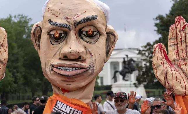 With the White House in the background, demonstrators protest the visit of Israeli Prime Minister Benjamin Netanyahu to the White House during a rally at Lafayette Park, Thursday, July 25, 2024, in Washington. (AP Photo/Jose Luis Magana)