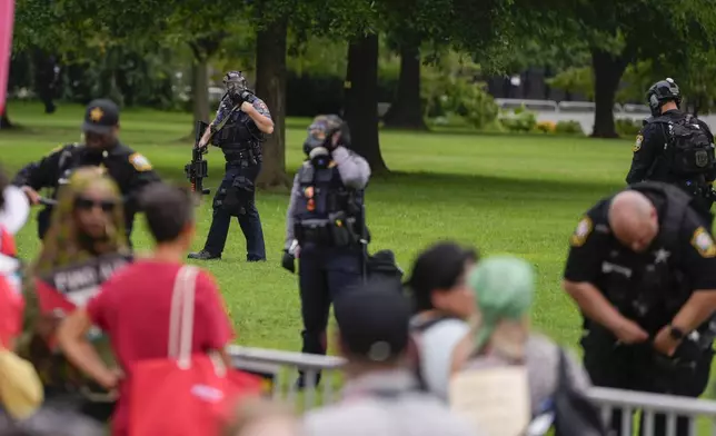 Law enforcement officers take their positions as demonstrators protest at the Capitol during Israeli Prime Minister Benjamin Netanyahu's visit on Wednesday, July 24, 2024, in Washington. (AP Photo/Matt Slocum)