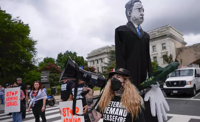 Demonstrators begin blocking traffic on Independence Ave., near the National Mall ahead of a scheduled visit by Israeli Prime Minister Benjamin Netanyahu to the US Capitol, Wednesday, July 24, 2024, in Washington. (AP Photo/Matt Slocum)