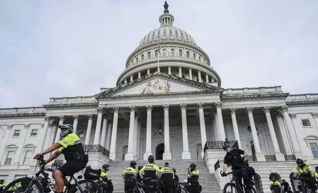 U.S. Capitol Police and NYPD officers stand in front of the Capitol ahead of Israeli Prime Minister Benjamin Netanyahu's speech to a joint meeting of Congress to seek support for Israel's fight against Hamas and other adversaries, Wednesday, July 24, 2024, in Washington. (AP Photo/Julia Nikhinson)