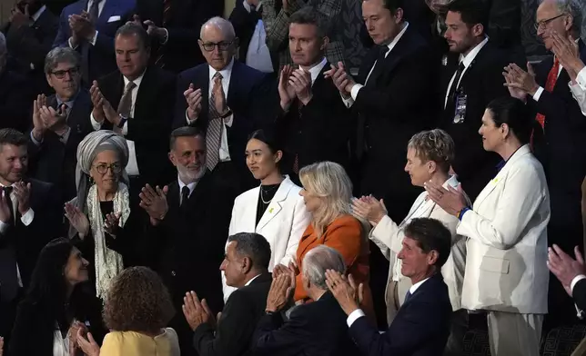 Former hostage Noa Argamani, center in white, is applauded as Israeli Prime Minister Benjamin Netanyahu speaks to a joint meeting of Congress at the Capitol in Washington, Wednesday, July 24, 2024. (AP Photo/Julia Nikhinson)