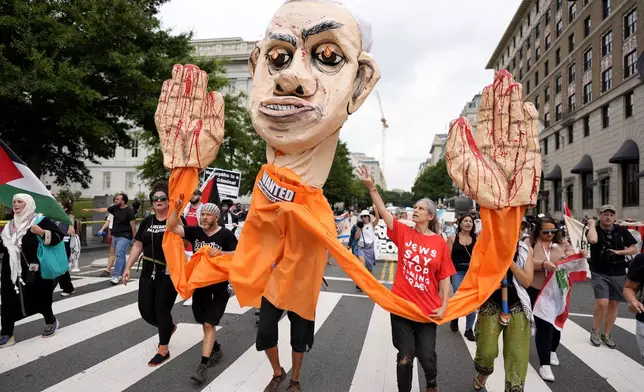 Demonstrators protest the visit of Israeli Prime Minister Benjamin Netanyahu to the White House during a rally, Thursday, July 25, 2024, in Washington. (AP Photo/Mike Stewart)