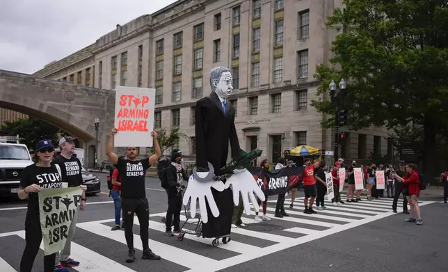 Demonstrators blocking traffic on Independence Ave., near the National Mall ahead of a scheduled visit by Israeli Prime Minister Benjamin Netanyahu to the US Capitol, Wednesday, July 24, 2024, in Washington. (AP Photo/Matt Slocum)