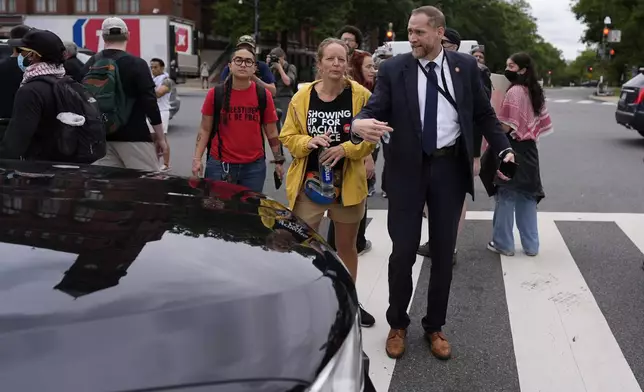 Protestors block traffic, Wednesday, July 24, 2024, in Washington, ahead of a scheduled visit by Israeli Prime Minister Benjamin Netanyahu at the U.S. Capitol. (AP Photo/Mike Stewart)