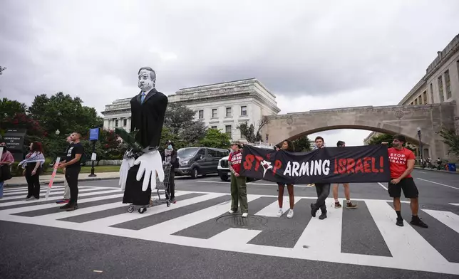 Demonstrators blocking traffic on Independence Ave., near the National Mall ahead of a scheduled visit by Israeli Prime Minister Benjamin Netanyahu to the US Capitol, Wednesday, July 24, 2024, in Washington. (AP Photo/Matt Slocum)