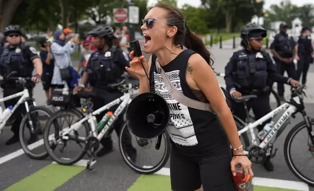 A demonstrator protests the visit of Israeli Prime Minister Benjamin Netanyahu to the White House during a rally, Thursday, July 25, 2024, in Washington. (AP Photo/Mike Stewart)