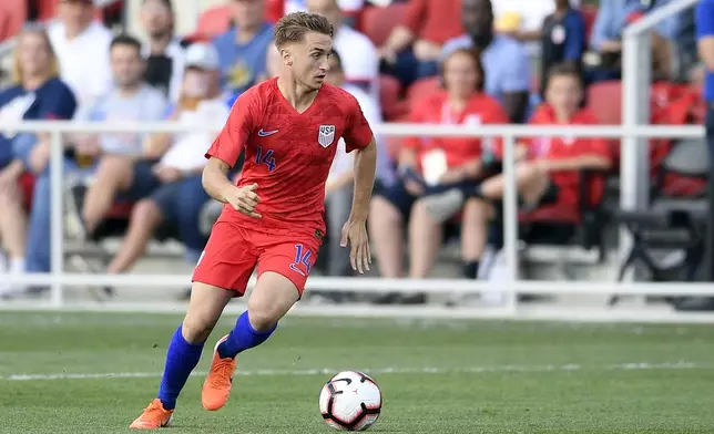 FILE - United States midfielder Djordje Mihailovic (14) dribbles the ball during the first half of an international friendly soccer match against Jamaica, Wednesday, June 5, 2019, in Washington. Defenders Miles Robinson and Walker Zimmerman along with forward Djordje Mihailovic will be the three overage players on the 18-man U.S. Olympic men’s soccer roster after failing to get used by the senior national team at the Copa America. Olympic soccer is limited to players under 23, with each team allowed three over the age limit. (AP Photo/Nick Wass, File)