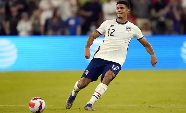 FILE - United States' Miles Robinson (12) during a FIFA World Cup qualifying soccer match against Jamaica, Thursday, Oct. 7, 2021, in Austin, Texas. Defenders Miles Robinson and Walker Zimmerman along with forward Djordje Mihailovic will be the three overage players on the 18-man U.S. Olympic men’s soccer roster after failing to get used by the senior national team at the Copa America. Olympic soccer is limited to players under 23, with each team allowed three over the age limit. (AP Photo/Eric Gay, File)