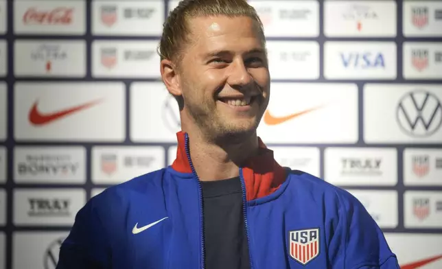 Walker Zimmerman, a defender on the United States men's olympics Soccer team, smiles during a news conference in New York, Monday, July 8, 2024. (AP Photo/Seth Wenig)