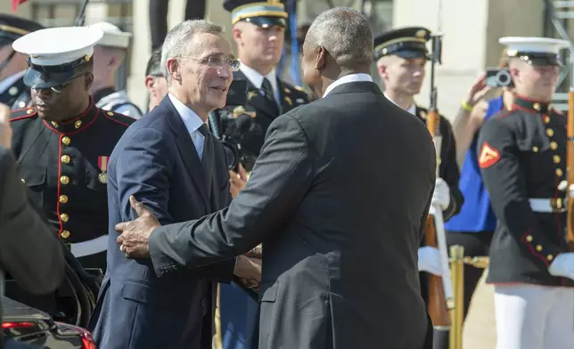 Defense Secretary Lloyd Austin, right, welcomes NATO Secretary General Jens Stoltenberg to the Pentagon on Monday, July 8, 2024 in Washington. (AP Photo/Kevin Wolf)