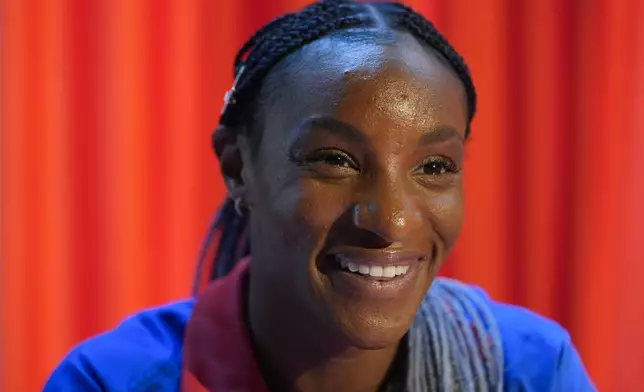 Crystal Dunn, a player on the United States women's olympic soccer team, speaks to reporters after a news conference in New York, Monday, July 8, 2024. (AP Photo/Seth Wenig)