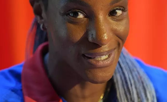 Crystal Dunn, a player on the United States women's olympic soccer team, speaks to reporters after a news conference in New York, Monday, July 8, 2024. (AP Photo/Seth Wenig)