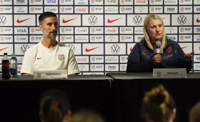 Head coaches of the United States men's and women's olympic soccer teams, Marko Mitrovic and Emma Hayes, take questions during a news conference in New York, Monday, July 8, 2024. (AP Photo/Seth Wenig)